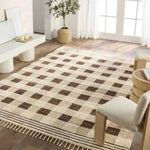 The Desouk Berkshire melds modern allure with the global vibes of Morocco. The Berkshire hand-knotted rug showcases a geometric grid pattern with contrasting brown, cream, and tan tones. This handcrafted rug boasts plush, cut wool pile that pairs beautifully with braided tassel details. Amethyst Home provides interior design, new home construction design consulting, vintage area rugs, and lighting in the Newport Beach metro area.