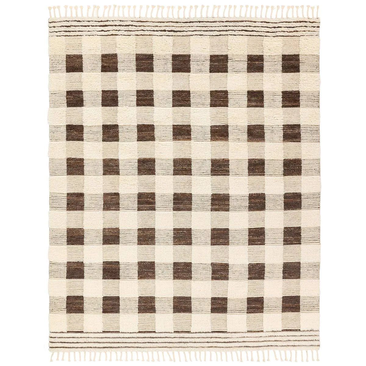 The Desouk Berkshire melds modern allure with the global vibes of Morocco. The Berkshire hand-knotted rug showcases a geometric grid pattern with contrasting brown, cream, and tan tones. This handcrafted rug boasts plush, cut wool pile that pairs beautifully with braided tassel details. Amethyst Home provides interior design, new home construction design consulting, vintage area rugs, and lighting in the Salt Lake City metro area.