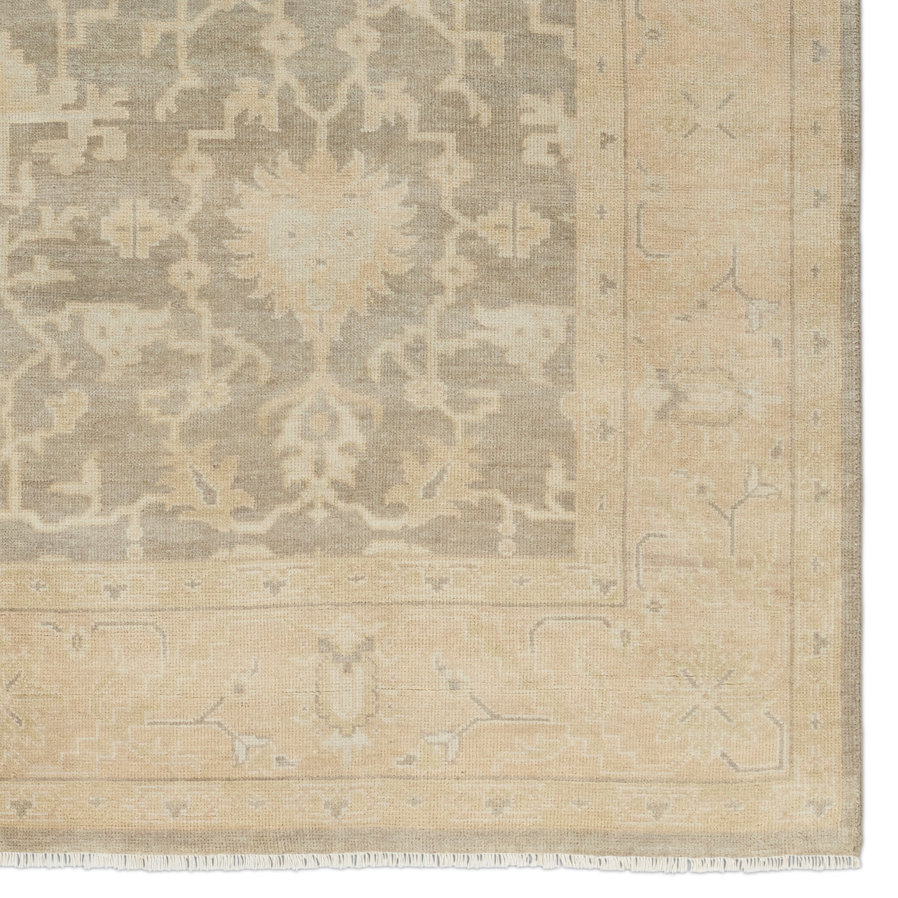 The Eloquent collection emanates traditional elegance, lending a soft and serene look to transitional homes. The Verity area rug features a faded Oushak design in muted beige, light gray, and tan tones. This hand-knotted wool and viscose rug grounds living spaces with a classic, earthy look. Amethyst Home provides interior design, new construction, custom furniture, and area rugs in the Newport Beach metro area.