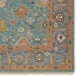 The updated traditional Everly collection features Oushak-inspired designs in whimsical color palettes. The Aloft design features a lively colorway of blue, pink, yellow, navy, cream, peach, and taupe. This hand-knotted wool rug anchors living spaces with a fresh take on vintage style. The low, easy-care pile delights in both high and low traffic areas of the home.  Amethyst Home provides interior design, new construction, custom furniture, and area rugs in the Austin metro area.