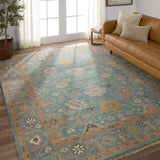 The updated traditional Everly collection features Oushak-inspired designs in whimsical color palettes. The Aloft design features a lively colorway of blue, pink, yellow, navy, cream, peach, and taupe. This hand-knotted wool rug anchors living spaces with a fresh take on vintage style. The low, easy-care pile delights in both high and low traffic areas of the home.  Amethyst Home provides interior design, new construction, custom furniture, and area rugs in the Des Moines metro area.