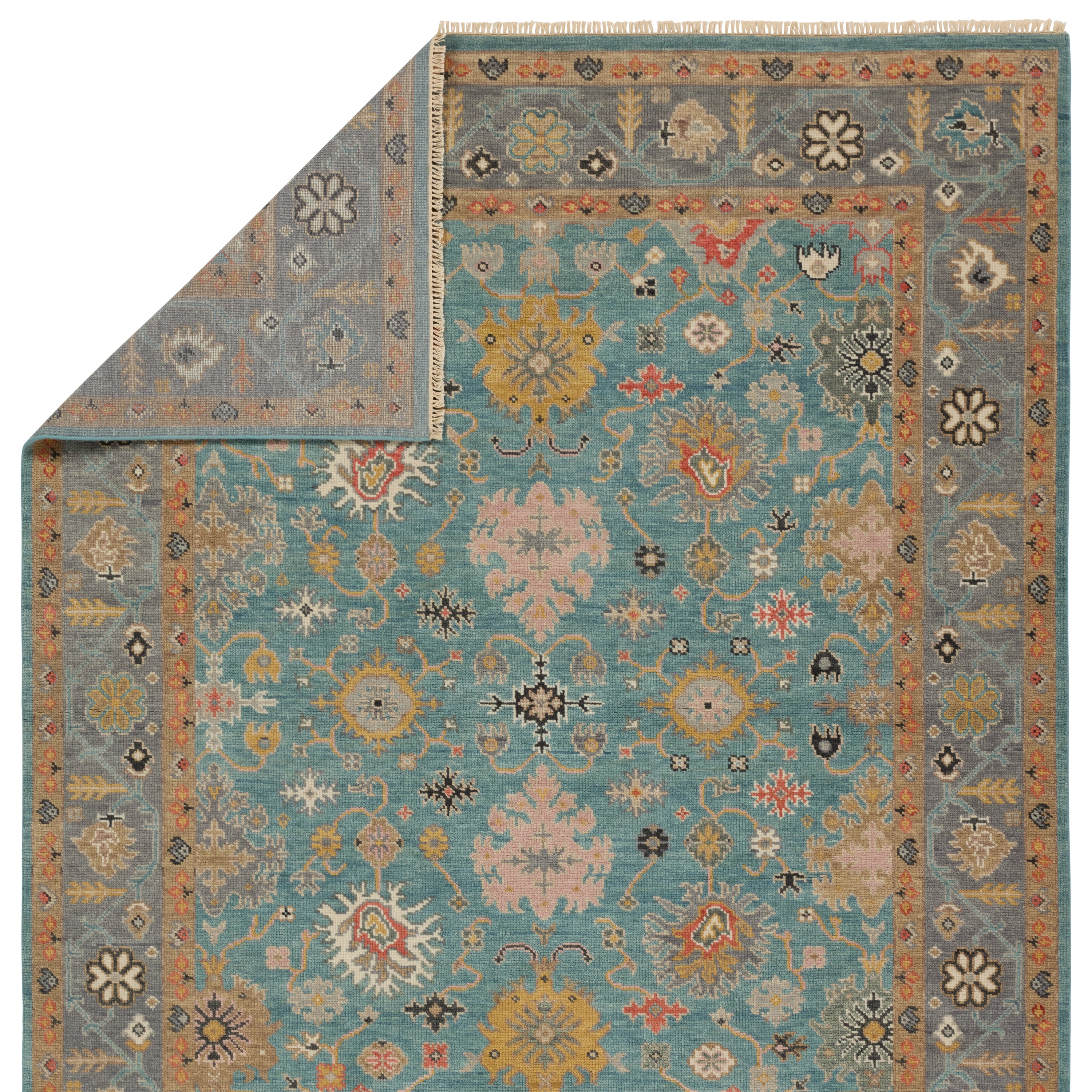The updated traditional Everly collection features Oushak-inspired designs in whimsical color palettes. The Aloft design features a lively colorway of blue, pink, yellow, navy, cream, peach, and taupe. This hand-knotted wool rug anchors living spaces with a fresh take on vintage style. The low, easy-care pile delights in both high and low traffic areas of the home.  Amethyst Home provides interior design, new construction, custom furniture, and area rugs in the Portland metro area.
