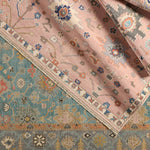 The updated traditional Everly collection features Oushak-inspired designs in whimsical color palettes. The Matera design features a sweet colorway of pink, yellow, navy, cream, peach, and taupe. This hand-knotted wool rug anchors living spaces with a fresh take on vintage style. The low, easy-care pile delights in both high and low traffic areas of the home.  Amethyst Home provides interior design, new construction, custom furniture, and area rugs in the Houston metro area.