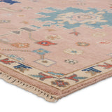 The updated traditional Everly collection features Oushak-inspired designs in whimsical color palettes. The Matera design features a sweet colorway of pink, yellow, navy, cream, peach, and taupe. This hand-knotted wool rug anchors living spaces with a fresh take on vintage style. The low, easy-care pile delights in both high and low traffic areas of the home.  Amethyst Home provides interior design, new construction, custom furniture, and area rugs in the San Diego metro area.