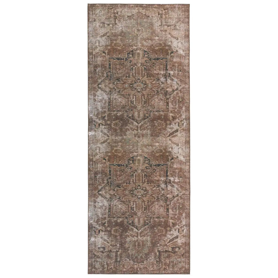 Inspired by well-traveled vintage designs, Kate Lester has joined with Jaipur Living to launch the Harman Hold Rug. This impressive assortment of antique textile designs lends heirloom-quality looks and livable style to any space. The Minita area rug showcases a faded medallion pattern emphasized by hues of brown, tan, and hints of blue. Amethyst Home provides interior design services, furniture, rugs, and lighting in the Miami metro area.
