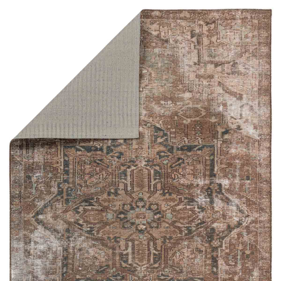 Inspired by well-traveled vintage designs, Kate Lester has joined with Jaipur Living to launch the Harman Hold Rug. This impressive assortment of antique textile designs lends heirloom-quality looks and livable style to any space. The Minita area rug showcases a faded medallion pattern emphasized by hues of brown, tan, and hints of blue. Amethyst Home provides interior design services, furniture, rugs, and lighting in the Omaha metro area.
