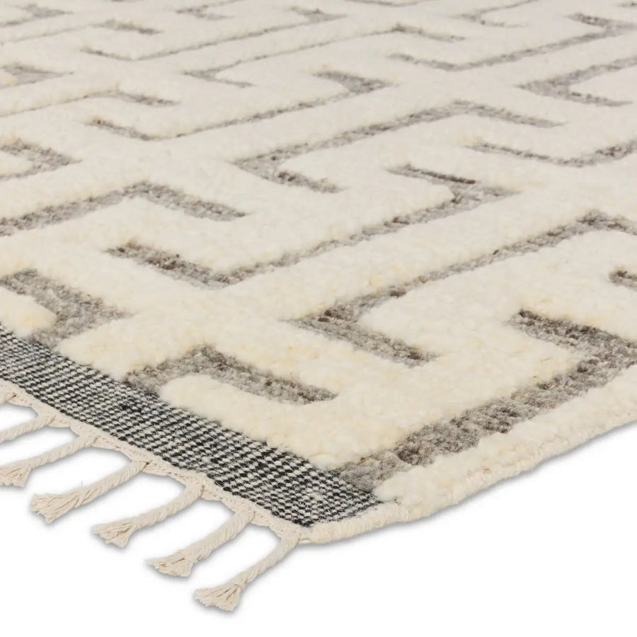 The Keoka Semra Rug boasts a fresh take on classic Afghani hand-knotted textiles. In rich, grounding tones of gray and ivory, the stylish contrast of the rug anchors room with bold yet neutral appeal. Amethyst Home provides interior design services, furniture, rugs, and lighting in the Miami metro area.