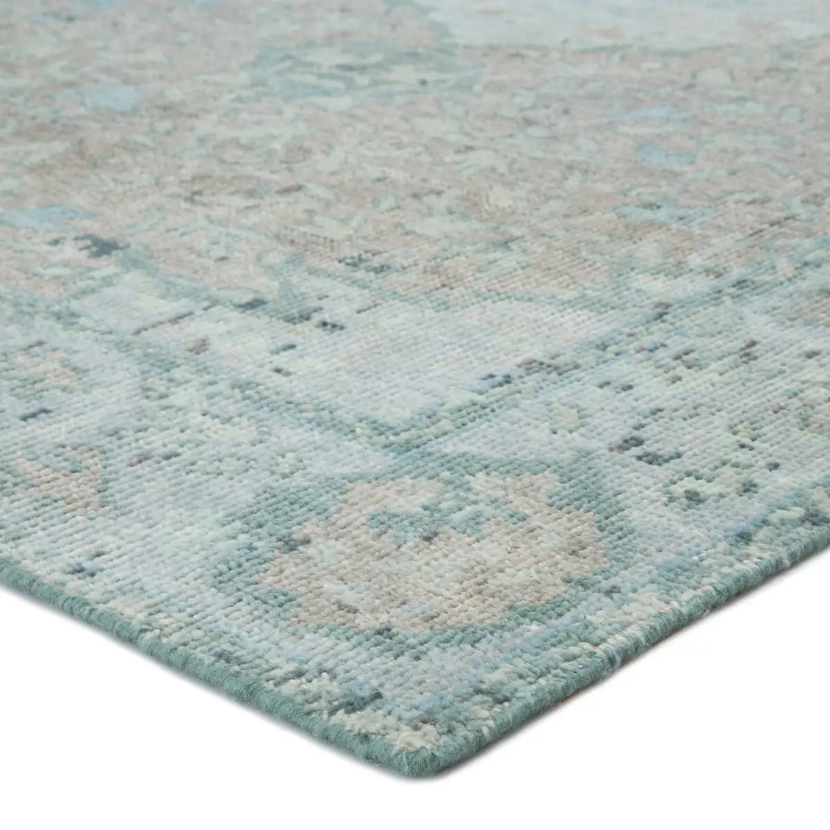 Exceptionally made and artfully designed, this hand-knotted area rug infuses contemporary homes with vintage allure. An on-trend colorway of vibrant aqua, beige, and dark gray lends a fresh update to the floral and medallion design, while a patina-rich antiqued effect creates a timeless look. Amethyst Home provides interior design services, furniture, rugs, and lighting in the Omaha metro area.