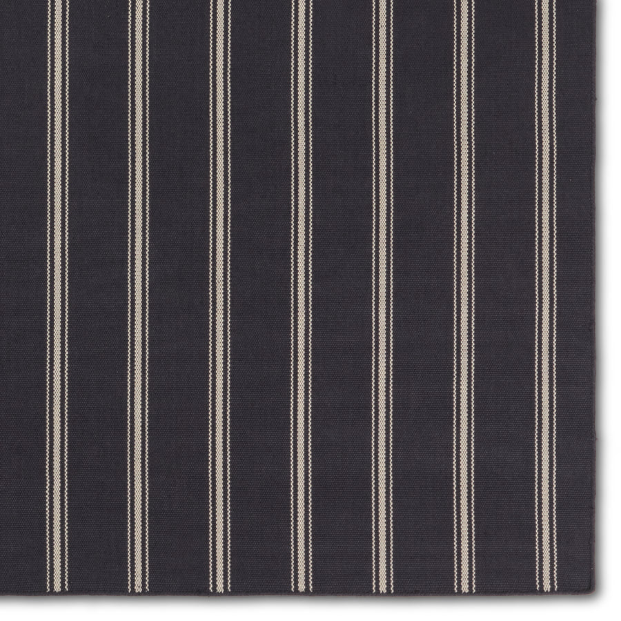 The handwoven Laguna collection is an easy-going, classic statement for both indoor and outdoor spaces. Crafted of soft, flatwoven PET yarns, these traditional hues and striped designs set the tone for simple sophistication. The Memento rug utilizes thin and thick stripes to add dimension and style. The navy and ivory colorway delights in both high and low traffic areas of the home. Amethyst Home provides interior design, new construction, custom furniture, and area rugs in the Des Moines metro area.