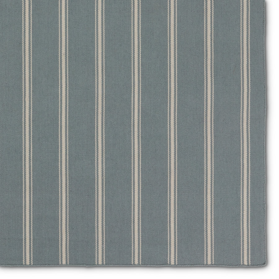 The handwoven Laguna collection is an easy-going, classic statement for both indoor and outdoor spaces. Crafted of soft, flatwoven PET yarns, these traditional hues and striped designs set the tone for simple sophistication. The Memento rug utilizes thin and thick stripes to add dimension and style. The slate and ivory colorway delights in both high and low traffic areas of the home. Amethyst Home provides interior design, new construction, custom furniture, and area rugs in the Boston metro area.