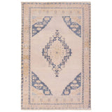 Distressed, vintage designs offer an elevated tone for the Lumal Collection. The Debolo rug features a vintage-inspired medallion, geometric border, and floral detailing in tones of tan, blue, yellow, and gray. This machine washable rug is stain resistant and easy to clean, perfect for homes with children and pets. Amethyst Home provides interior design, new home construction design consulting, vintage area rugs, and lighting in the Alpharetta metro area.