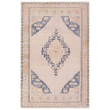 Featuring Lumal Debolo Rug by Jaipur Living at Amethyst Home. Distressed, vintage designs offer an elevated tone for the Lumal Collection. The Debolo rug features a vintage-inspired medallion, geometric border, and floral detailing in tones of tan, blue, yellow, and gray. This machine washable rug is stain resistant and easy to clean, perfect for homes wit. Amethyst Home provides interior design, new home construction design consulting, vintage area rugs, and lighting in the Alpharetta metro area.