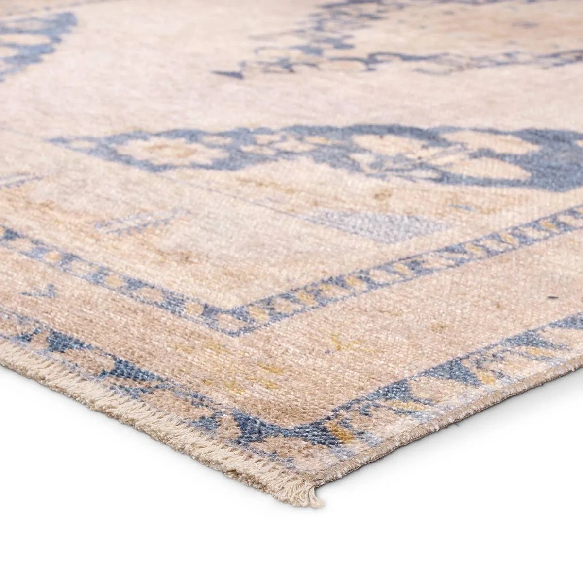 Distressed, vintage designs offer an elevated tone for the Lumal Collection. The Debolo rug features a vintage-inspired medallion, geometric border, and floral detailing in tones of tan, blue, yellow, and gray. This machine washable rug is stain resistant and easy to clean, perfect for homes with children and pets. Amethyst Home provides interior design, new home construction design consulting, vintage area rugs, and lighting in the Charlotte metro area.