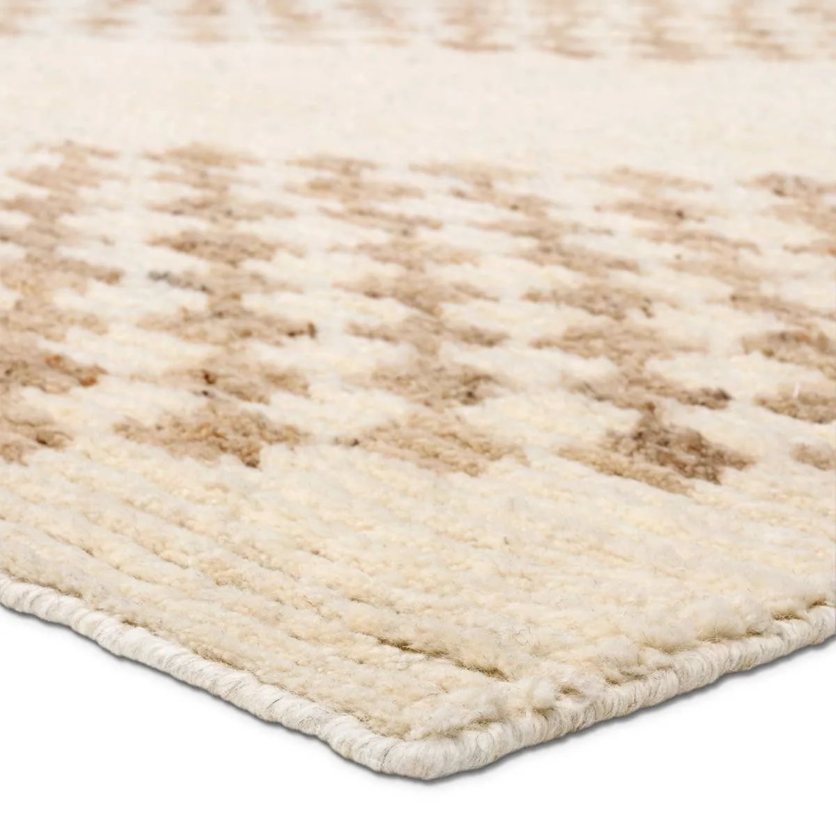 A stunning array of globally inspired designs in neutral tones define the handknotted Merzouga by Heja Home Sarenthia. The Moroccan-inspired Sarenthia design showcases several checkered diamonds in cream and taupe tones. The 100% wool pile is soft underfoot and inherently stain-resistant. Amethyst Home provides interior design, new home construction design consulting, vintage area rugs, and lighting in the Kansas City metro area.