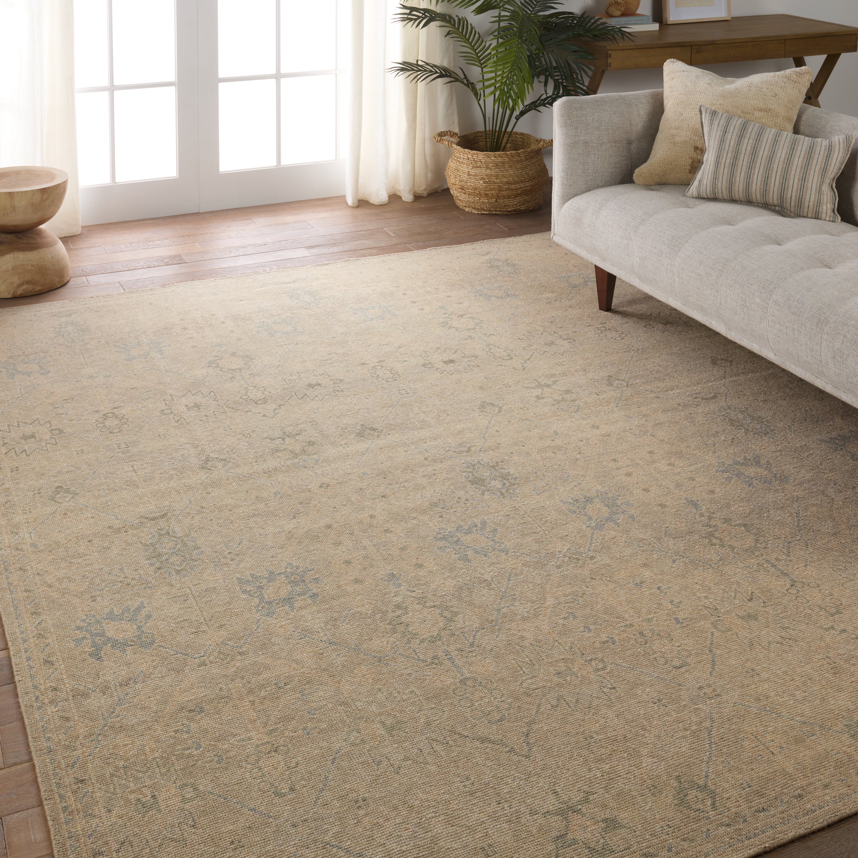The Onessa collection marries traditional motifs with soft, subdued colorways for the perfect blend of fresh and time-honored style. These hand-knotted wool rugs feature a hand-sheared quality that lends the design a coveted vintage impression. The Joan rug features a distressed, floral Oushak pattern in hues of tan, blue, taupe, cream, and gray. Amethyst Home provides interior design, new construction, custom furniture, and area rugs in the Boston metro area.