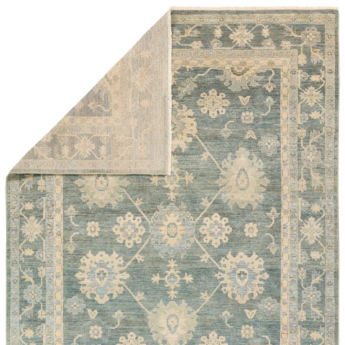 The Orenda Kerensa features heirloom-quality designs of muted and uniquely updated Old World patterns. The Kerensa area rug boasts a beautifully washed medallion motif with an antique Oushak-inspired vibe. The cream tone is accented with cool blues, greens, and warm beige hues for added depth and intrigue. Amethyst Home provides interior design, new home construction design consulting, vintage area rugs, and lighting in the Nashville metro area.