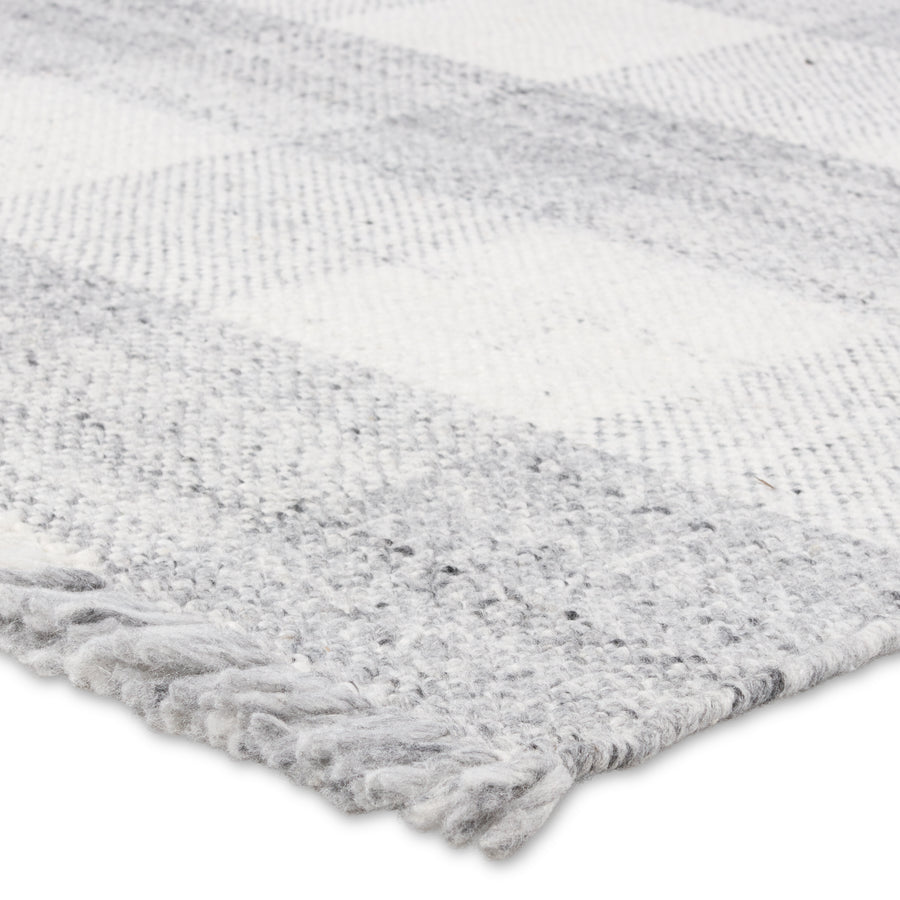 The Respite collection of handwoven designs showcases a fresh take on a classic pattern. Crafted of durable and easy-to clean polyester, these soft and fringe-detailed rugs lend a timeless charm to any space. The Truce design exudes a farmhouse and contemporary vibe with a pleasant gray and ivory colorway. Amethyst Home provides interior design, new construction, custom furniture, and area rugs in the Omaha metro area.