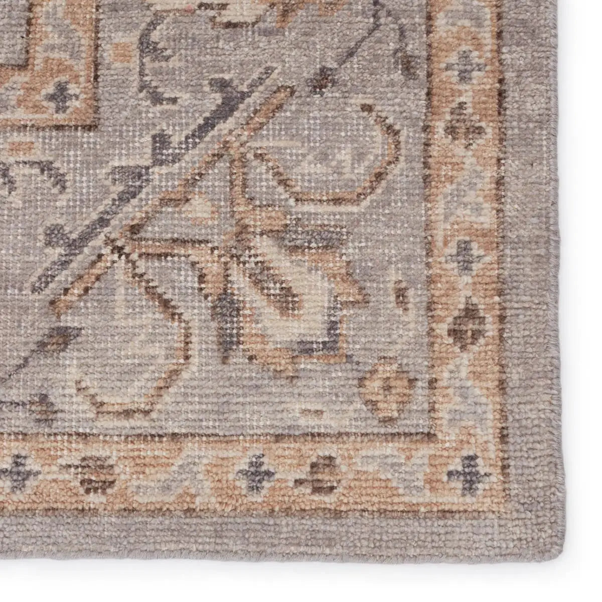 The Revolution Wyndham rug is inspired by traditional style and beautifully detailed antique textile designs. The hand-knotted Wyndham area rug showcases a classic motif in neutral tones of gray and warm tan. Amethyst Home provides interior design services, furniture, rugs, and lighting in the New York metro area.