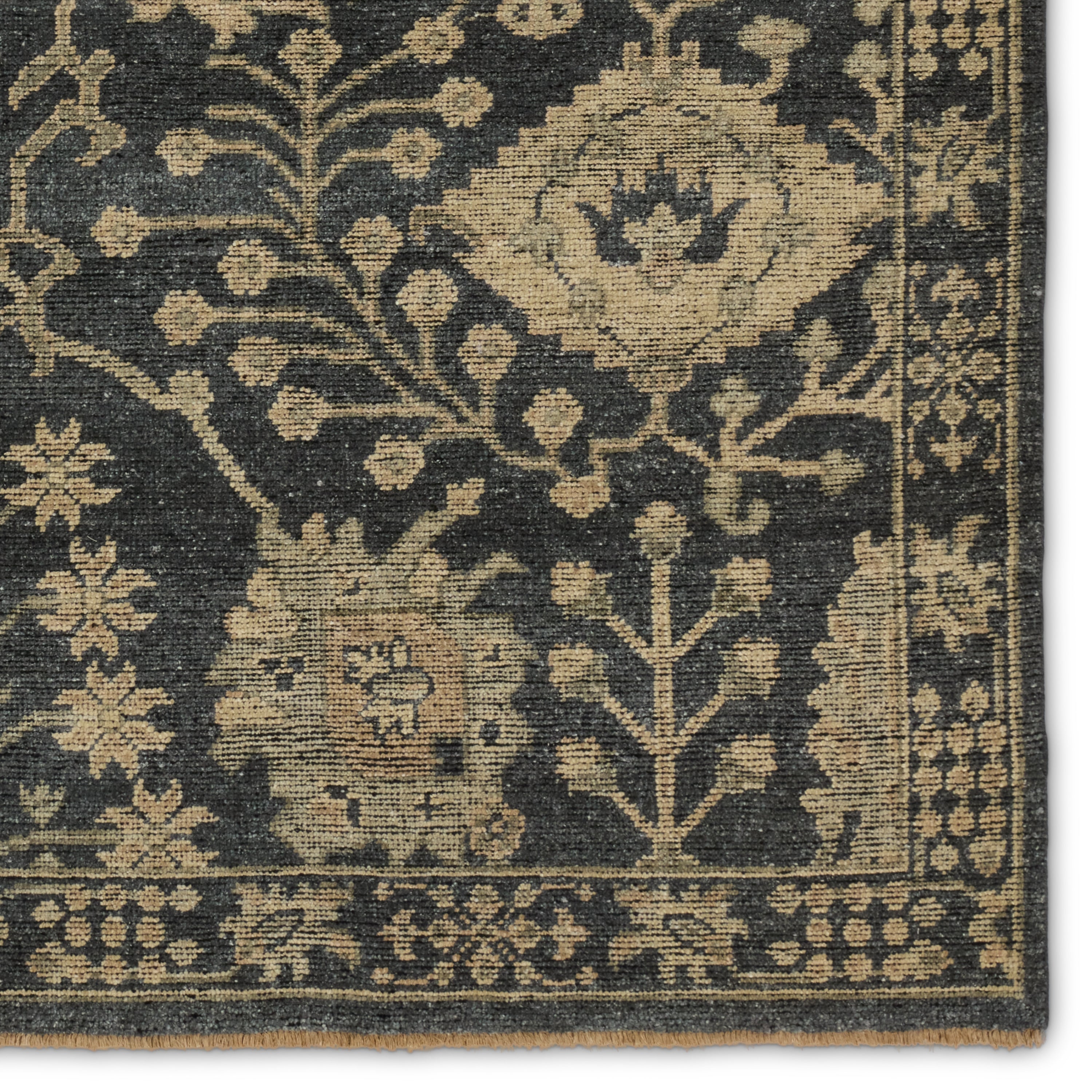 The Rhapsody collection features heirloom-quality designs of stunningly abrashed Old World patterns. The Maeli area rug boasts a beautifully washed Oushak motif with a decorative border. The dark gray tones are accented with khaki, cream, green, and beige hues for added depth and intrigue. This durable wool handknot anchors living spaces with a fresh take on vintage style. Amethyst Home provides interior design, new construction, custom furniture, and area rugs in the Scottsdale metro area.