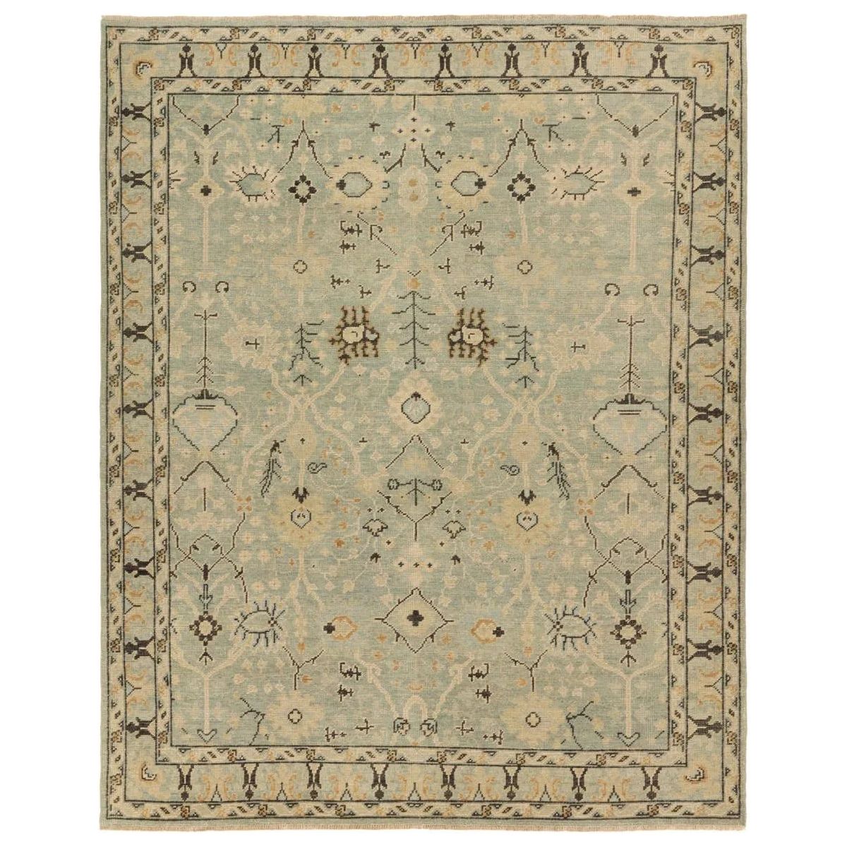 The Rhapsody Markid features heirloom-quality designs of stunningly abrashed Old World patterns. The Markid area rug boasts a beautifully distressed floral and Oushak motif with a decorative border. The light blue and tan tones are accented with black and beige hues for added depth and intrigue. Amethyst Home provides interior design, new home construction design consulting, vintage area rugs, and lighting in the Des Moines metro area.