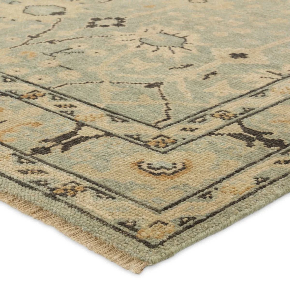 The Rhapsody Markid features heirloom-quality designs of stunningly abrashed Old World patterns. The Markid area rug boasts a beautifully distressed floral and Oushak motif with a decorative border. The light blue and tan tones are accented with black and beige hues for added depth and intrigue. Amethyst Home provides interior design, new home construction design consulting, vintage area rugs, and lighting in the Scottsdale metro area.