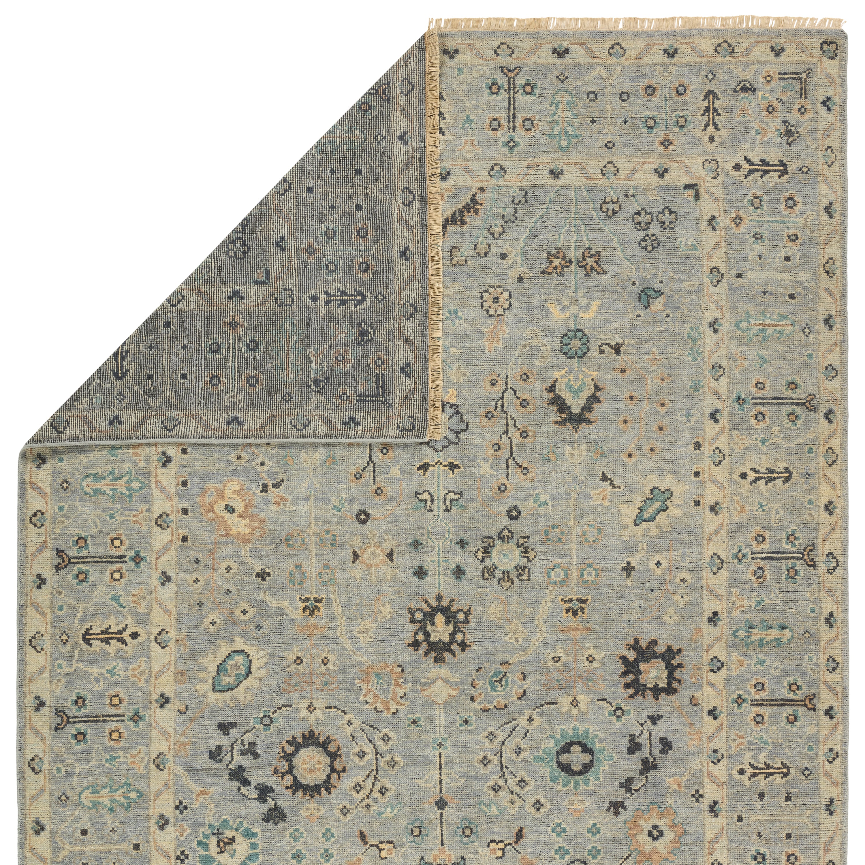 The Rhapsody collection features heirloom-quality designs of stunningly abrashed Old World patterns. The Nysa area rug boasts a beautifully washed floral motif with a decorative border. The blue tone is accented with rich green, tan, navy, and cream hues for added depth and intrigue. This durable wool handknot anchors living spaces with a fresh take on vintage style. Amethyst Home provides interior design, new construction, custom furniture, and area rugs in the Kansas City metro area.