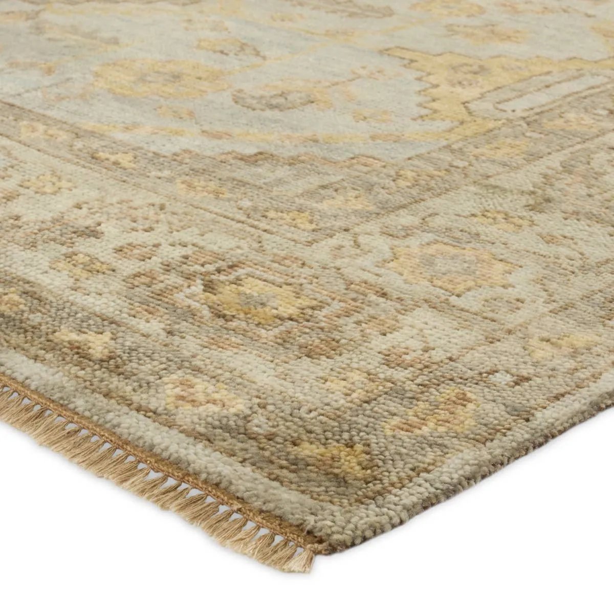 The Rhapsody Gehenna features heirloom-quality designs of stunningly abrashed Old World patterns. The Gehenna area rug boasts a beautifully distressed medallion motif with a decorative border and floral detailing. The gray and brown tones are accented with light blue, sage, beige, and yellow hues for added depth and intrigue. Amethyst Home provides interior design, new home construction design consulting, vintage area rugs, and lighting in the Alpharetta metro area.