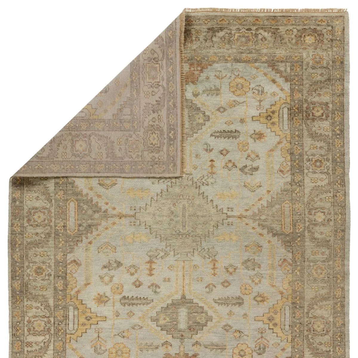 The Rhapsody Gehenna features heirloom-quality designs of stunningly abrashed Old World patterns. The Gehenna area rug boasts a beautifully distressed medallion motif with a decorative border and floral detailing. The gray and brown tones are accented with light blue, sage, beige, and yellow hues for added depth and intrigue. Amethyst Home provides interior design, new home construction design consulting, vintage area rugs, and lighting in the Washington metro area.