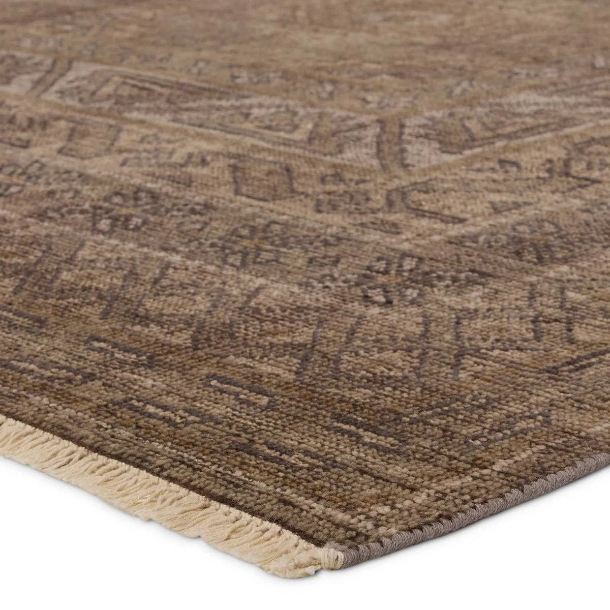 The Rhapsody Kortan features heirloom-quality designs of stunningly abrashed Old World patterns. The Kortan area rug boasts a beautifully distressed mini-medallion motif with a decorative, multi-layered border and geometric detailing. The brown, cream, and tan hues add depth and intrigue. Amethyst Home provides interior design, new home construction design consulting, vintage area rugs, and lighting in the Nashville metro area.