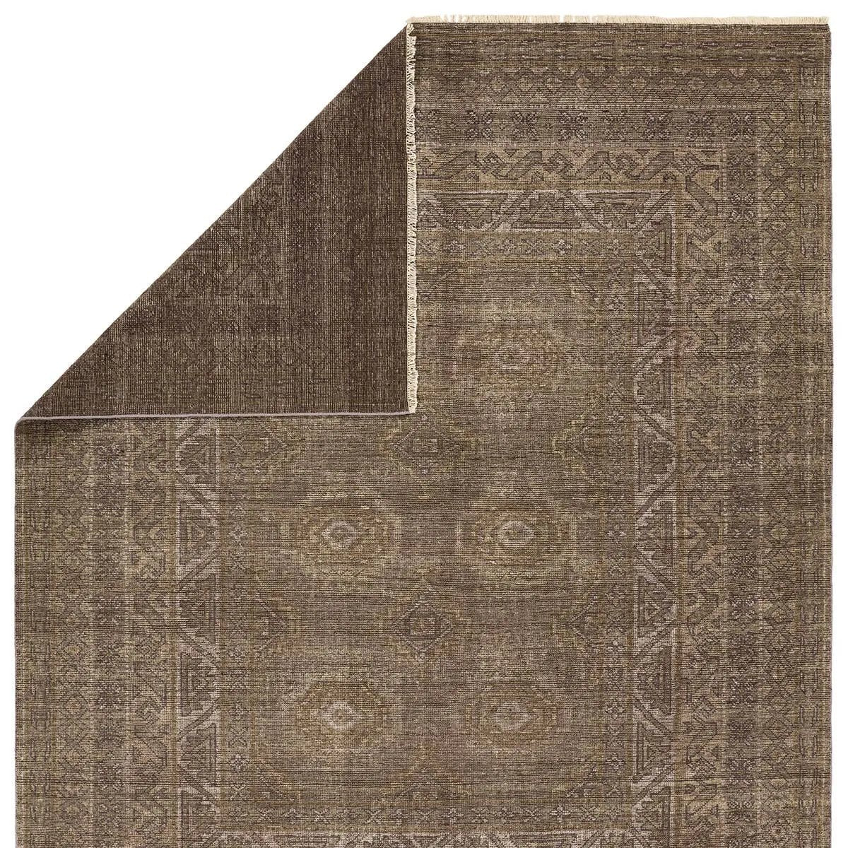 The Rhapsody Kortan features heirloom-quality designs of stunningly abrashed Old World patterns. The Kortan area rug boasts a beautifully distressed mini-medallion motif with a decorative, multi-layered border and geometric detailing. The brown, cream, and tan hues add depth and intrigue. Amethyst Home provides interior design, new home construction design consulting, vintage area rugs, and lighting in the Nashville metro area.