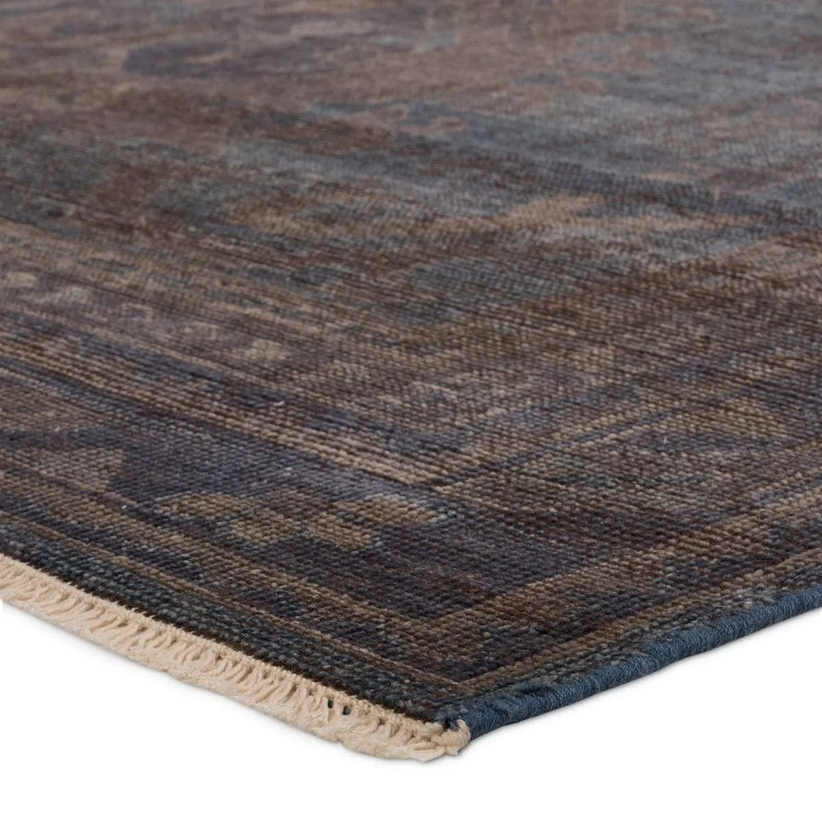 The Rhapsody Jodion features heirloom-quality designs of stunningly abrashed Old World patterns. The Jodion area rug boasts a beautifully distressed dual-medallion motif with a decorative, multi-layered border and geometric detailing. The blue, brown, and gray hues add depth and intrigue. Amethyst Home provides interior design, new home construction design consulting, vintage area rugs, and lighting in the Alpharetta metro area.