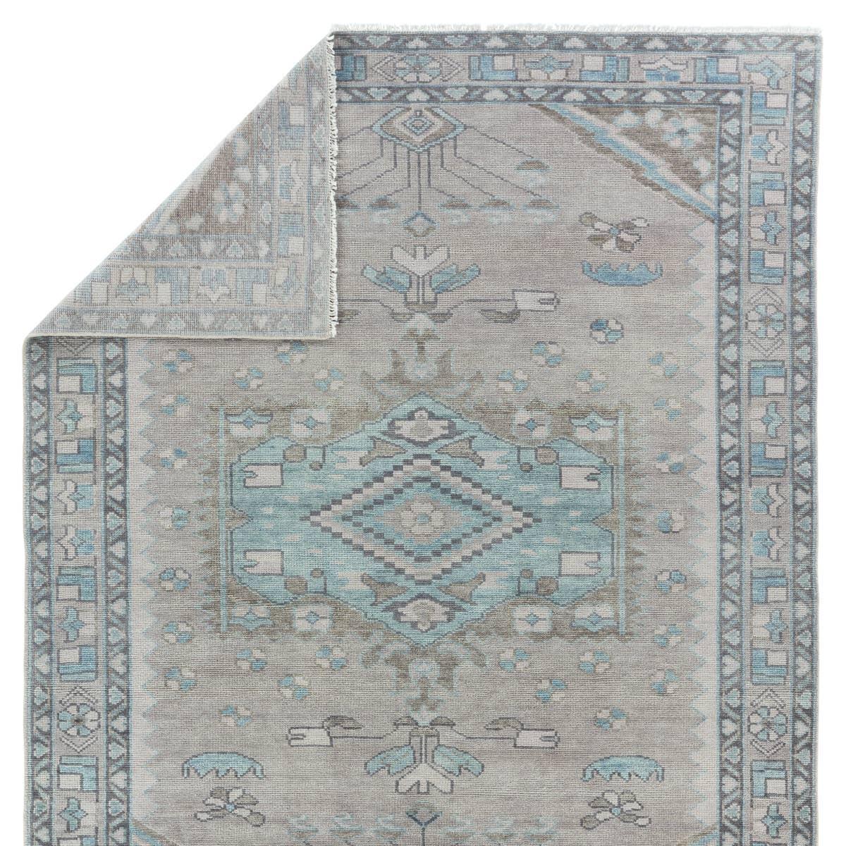 The Salinas Santita is punctuated by both vibrant and neutral hues and combined with intricate details, lending a stunning transitional look to any home. The Santita rug makes a moody statement with grounding hues and a tribal, medallion motifs. This durable, artisan-made rug features geometric accents in a serene gray, blue, and taupe colorway. Amethyst Home provides interior design, new home construction design consulting, vintage area rugs, and lighting in the Park City metro area.