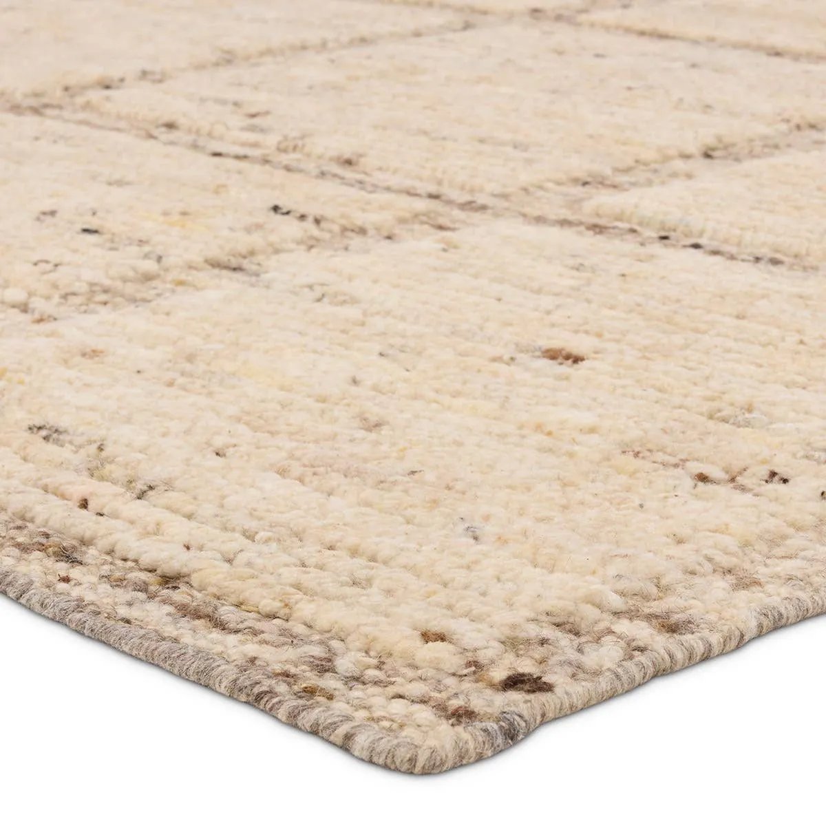 Subtle linear textures and natural colorways define the irresistible quality of the Seora Kizza. The Kizza area rug features a linear grid for an intriguing dose of modern appeal. The textural, wool pile contains no dye, reflecting the natural colors of the sheep, for a rich and grounding palette of cream, brown, gray, and flecks of black. Amethyst Home provides interior design, new home construction design consulting, vintage area rugs, and lighting in the Charlotte metro area.