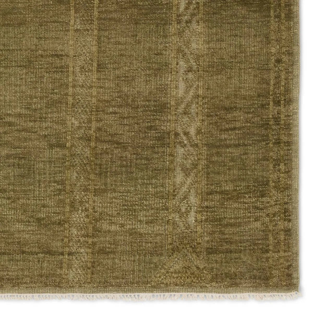 The hand-knotted Tapeten Achala features globally inspired designs that evoke a balance of tradition and modernity. The Achala pattern stuns with a high-low effect that distinguishes the olive green, geometric, striped pattern. Amethyst Home provides interior design, new home construction design consulting, vintage area rugs, and lighting in the Kansas City metro area.