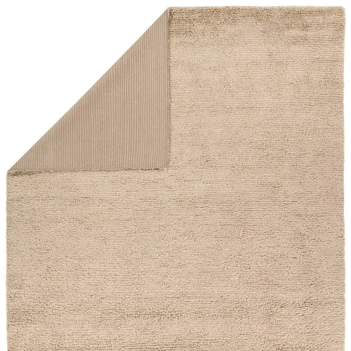 Featuring Vivre Dulcet Hand-Knotted Rug by Jaipur Living at Amethyst Home. The meticulously sourced, 100% Cashmere, Vivre Dulcet will completely transform your space. Indulge in unparalleled warmth and softness underfoot, as this hand knotted masterpiece defines sophistication and minimalistic perfection. With its solid Beige Dulcet design, this showstoppe. Amethyst Home provides interior design, new home construction design consulting, vintage area rugs, and lighting in the Des Moines metro area.