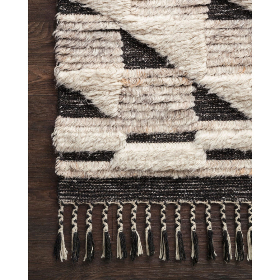 Khalid Natural/Black Rug - Amethyst Home A nod to timeless Moroccan style, the Khalid Collection is hand-knotted in India by skilled artisans. The soft pile features 100% natural, undyed wool, lending slight variations in tones that make each piece it's own. Plus, each rug is finished with a thoughtfully designed fringe.