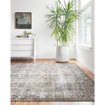 Layla Taupe/Stone Rug - Amethyst Home The Layla Collection is traditional and timeless, with a beautiful lived-in design that captures the spirit of an old-world rug. This traditional power-loomed rug is crafted of 100% polyester with a classic and sophisticated color palette and subtle patina.