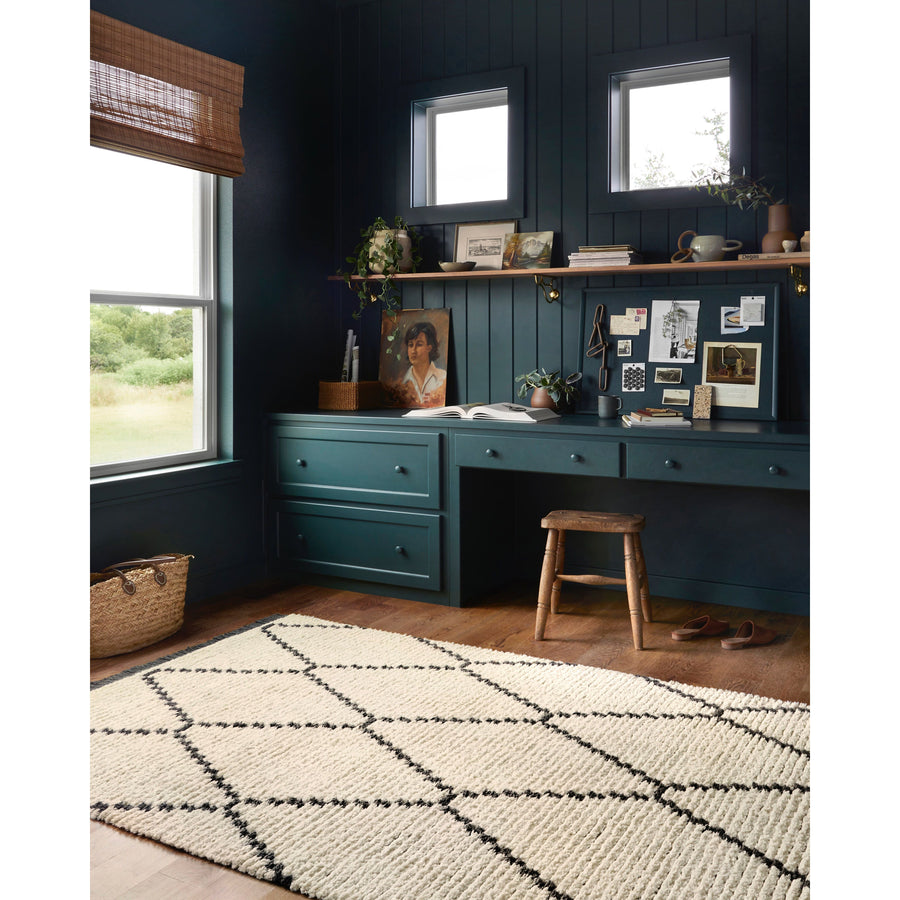 Durable, graphic, and soft underfoot, this rug is inspired by the classic Moroccan rug. The Alice Chris + Julia Cream / Charcoal ALI-04 rug features a high-low texture with warm earthy colors with a subtle fringe. The rug is easy to clean and maintain and perfect for living rooms, dining rooms, hallways, and kitchens!