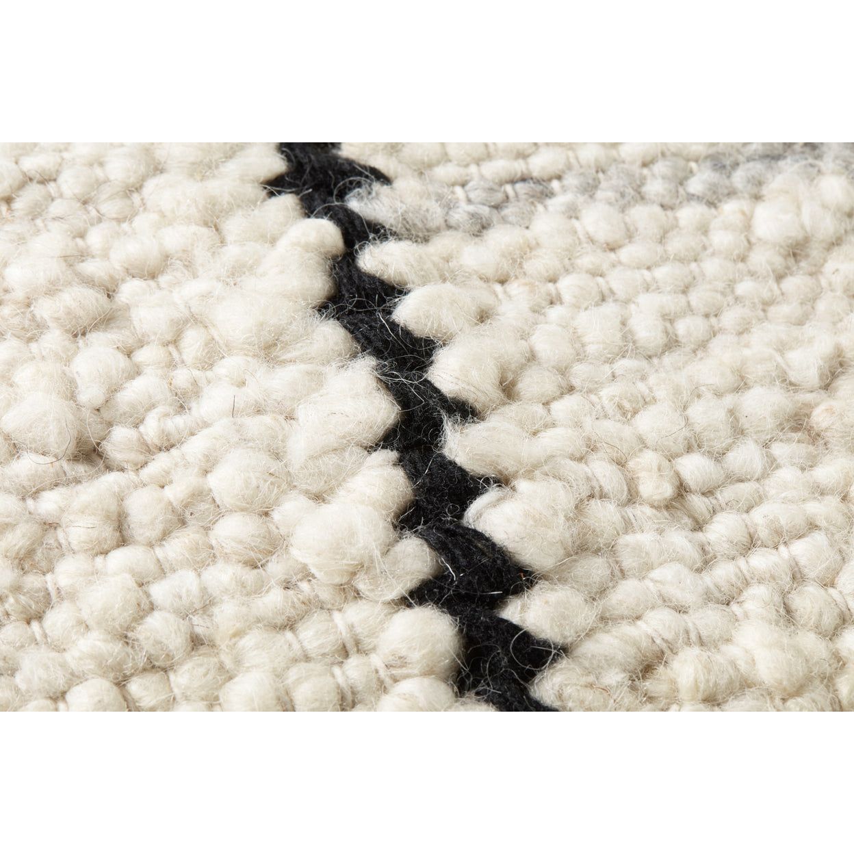 Featuring Amber Carla Ivory / Black  Pillow by Loloi at Amethyst Home. Experience the warmth and softness of the Amber Carla Ivory / Black Pillow. Hand woven with wool, polyester, and cotton, this pillow has a hidden flap closure and an antique bronze finish zipper with the Loloi logo. Finished with a knife edge and beige backing, this pillow will bring a . Amethyst Home provides interior design, new home construction design consulting, vintage area rugs, and lighting in the Washington metro area.