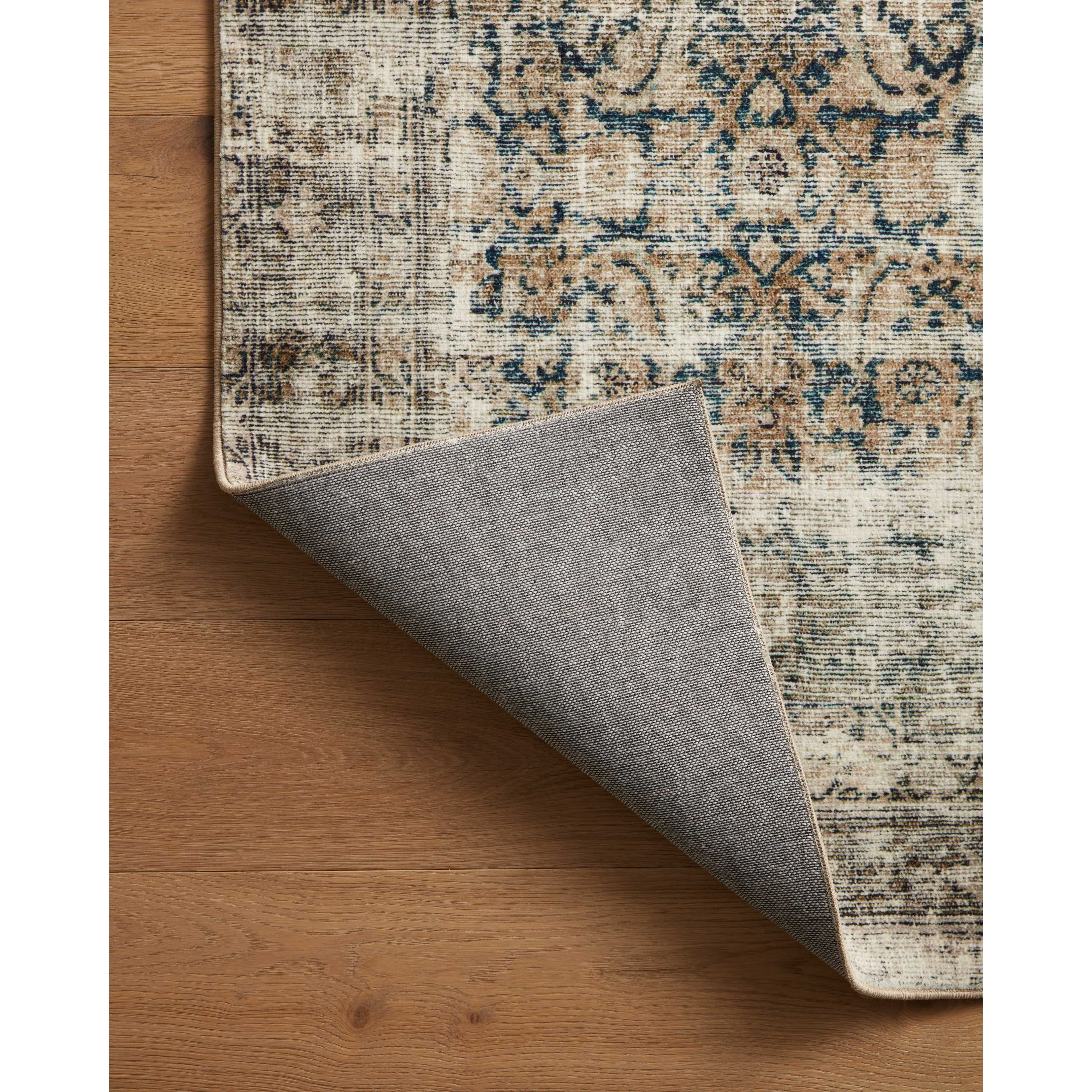 With the faded feel of an antique rug, the Amber Lewis x Loloi Morgan Navy / Sand Rug is a feat of modern printed construction. These impressive area rugs expertly blend sophisticated tones to recreate the dynamic colors of a vintage textiles. Power-loomed of CloudPile™ construction, these rugs are extra-soft to walk upon yet still durable for high-traffic rooms. Amethyst Home provides interior design services, furniture, rugs, and lighting in the Austin metro area.