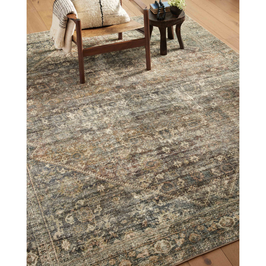 With the faded feel of an antique rug, the Amber Lewis x Loloi Morgan Spice / Lagoon Rug is a feat of modern printed construction. These impressive area rugs expertly blend sophisticated tones to recreate the dynamic colors of a vintage textiles. Power-loomed of CloudPile™ construction, these rugs are extra-soft to walk upon yet still durable for high-traffic rooms. Amethyst Home provides interior design services, furniture, rugs, and lighting in the Dallas metro area.