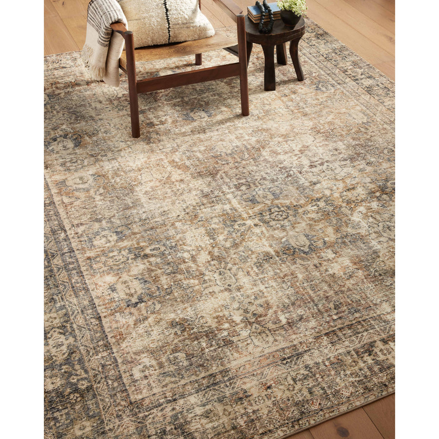 With the faded feel of an antique rug, the Amber Lewis x Loloi Morgan Sunset / Ink Rug is a feat of modern printed construction. These impressive area rugs expertly blend sophisticated tones to recreate the dynamic colors of a vintage textiles. Power-loomed of CloudPile™ construction, these rugs are extra-soft to walk upon yet still durable for high-traffic rooms. Amethyst Home provides interior design services, furniture, rugs, and lighting in the Dallas metro area.