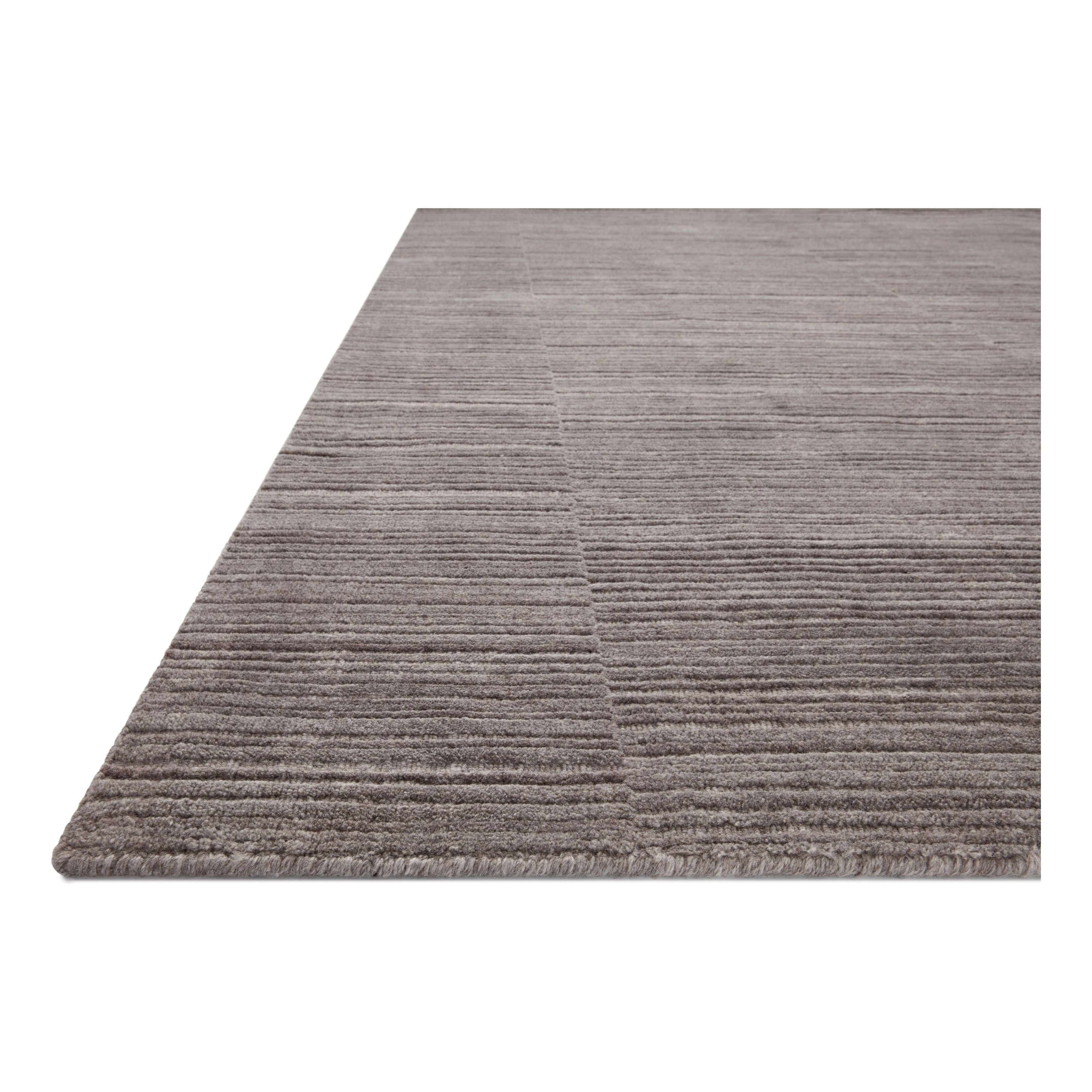 Sleek and modern, the Lou Collection is a luxurious hand-loomed area rug by Amber Lewis x Loloi. While the rug presents a minimal aesthetic, up close, it has a broken stripe pattern that creates a slightly ribbed effect. It’s made with a blend of wool and viscose that’s soft and durable, an elevated neutral for any room. Amethyst Home provides interior design, new home construction design consulting, vintage area rugs, and lighting in the Des Moines metro area.