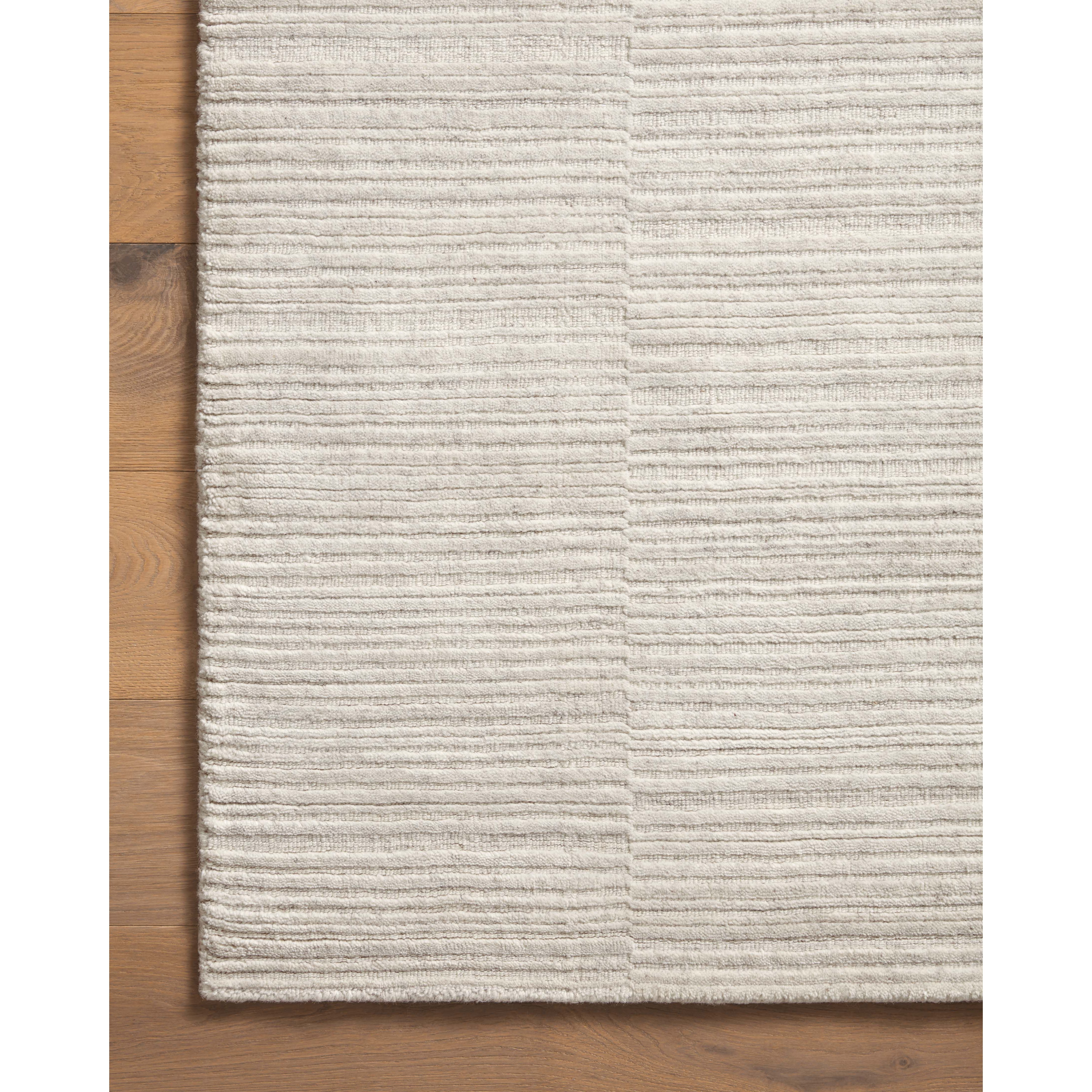 Sleek and modern, the Lou Collection is a luxurious hand-loomed area rug by Amber Lewis x Loloi. While the rug presents a minimal aesthetic, up close, it has a broken stripe pattern that creates a slightly ribbed effect. It’s made with a blend of wool and viscose that’s soft and durable, an elevated neutral for any room. Amethyst Home provides interior design, new home construction design consulting, vintage area rugs, and lighting in the Park City metro area.