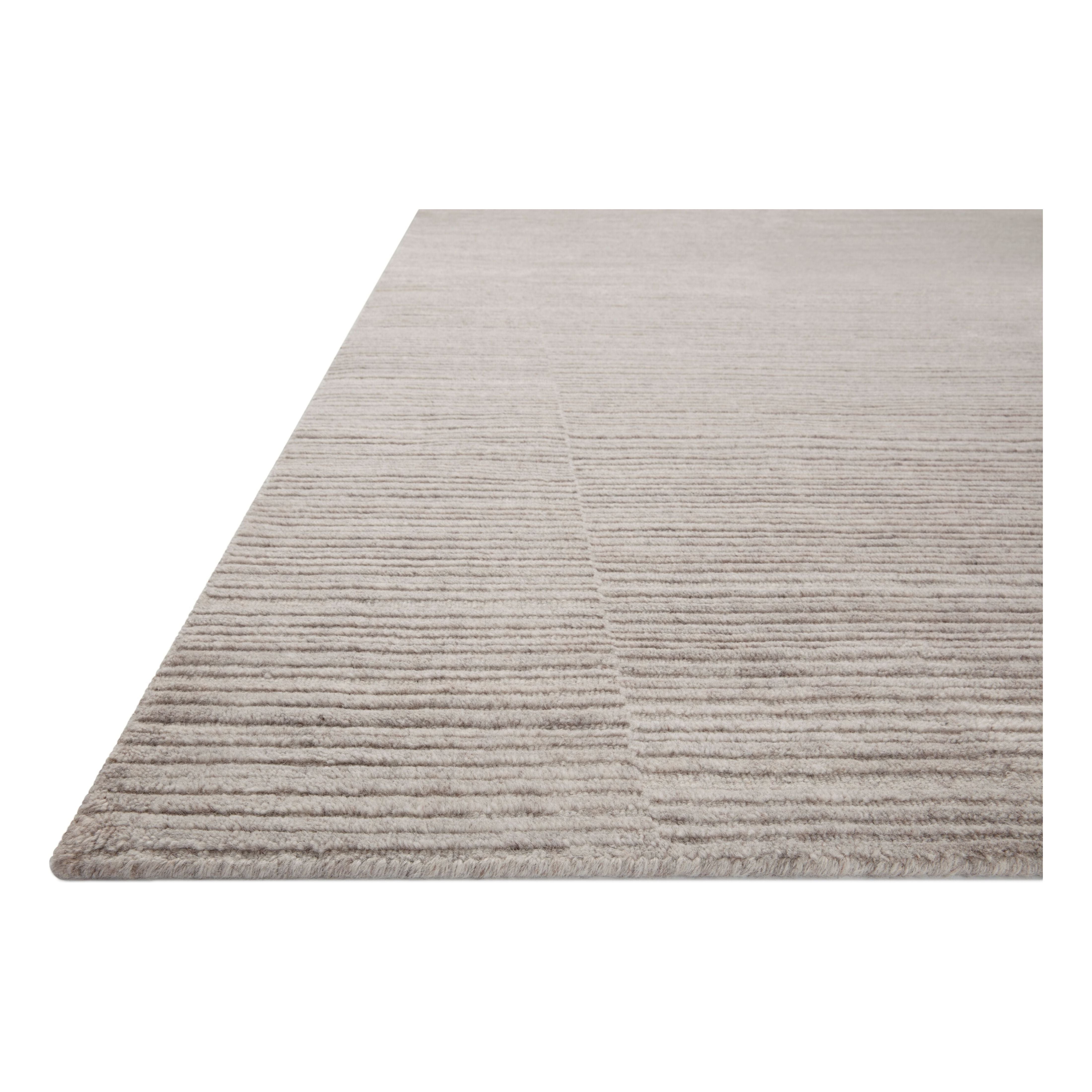 Sleek and modern, the Lou Collection is a luxurious hand-loomed area rug by Amber Lewis x Loloi. While the rug presents a minimal aesthetic, up close, it has a broken stripe pattern that creates a slightly ribbed effect. It’s made with a blend of wool and viscose that’s soft and durable, an elevated neutral for any room. Amethyst Home provides interior design, new home construction design consulting, vintage area rugs, and lighting in the San Diego metro area.