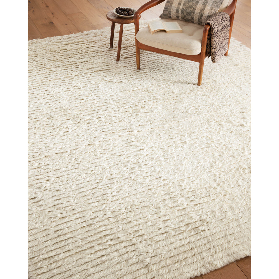 The Amber Lewis x Loloi Woodland Ivory Rug has a lush, soft pile inspired by the tree-lined city of Woodland, California. A slightly ridged construction adds dimension and movement to this stylish, modern rug. Amethyst Home provides interior design services, furniture, rugs, and lighting in the Salt Lake City metro area.