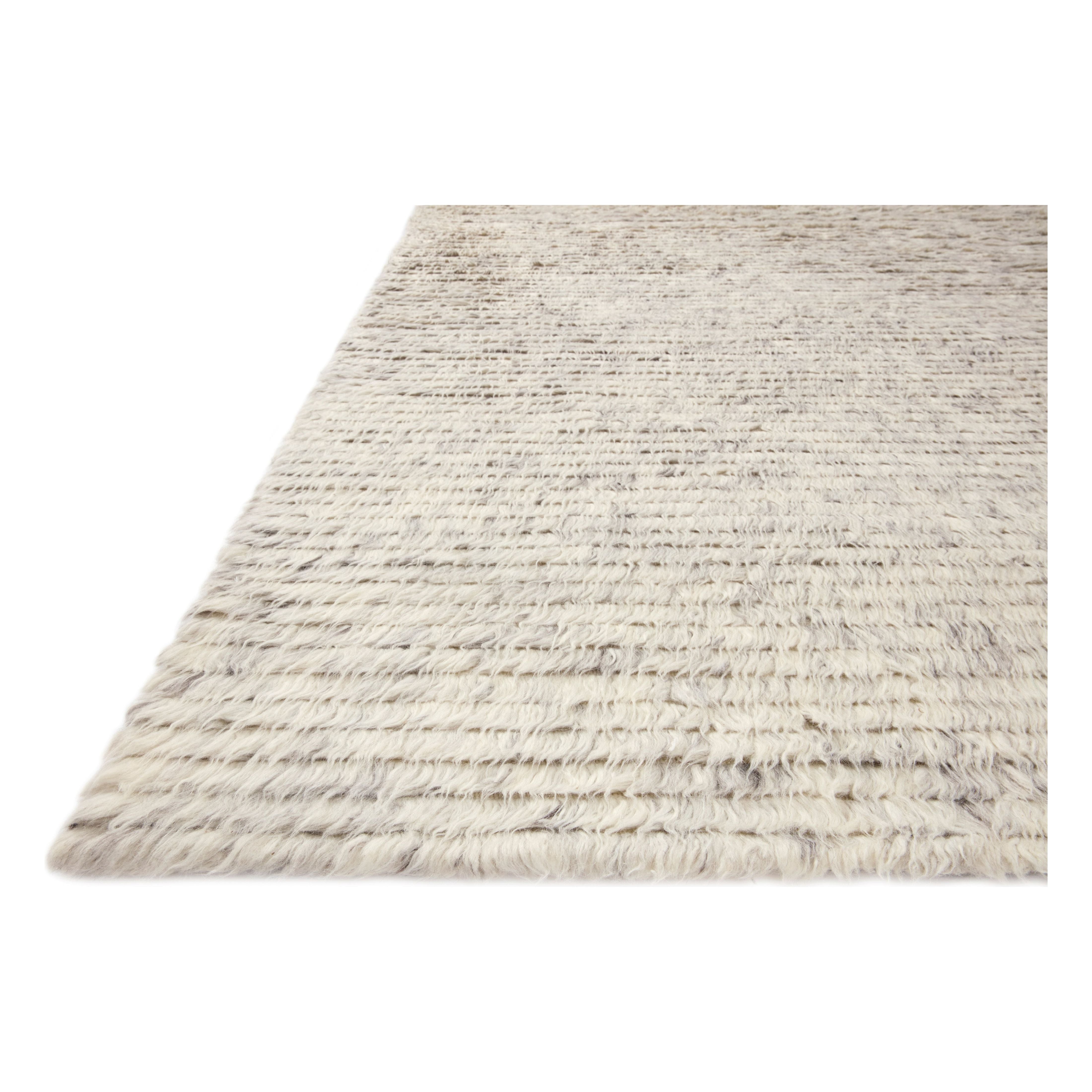The Amber Lewis x Loloi Woodland Silver Rug has a lush, soft pile inspired by the tree-lined city of Woodland, California. A slightly ridged construction adds dimension and movement to this stylish, modern rug. Amethyst Home provides interior design services, furniture, rugs, and lighting in the Seattle metro area.
