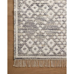 The Rivers Collection by Angela Rose x Loloi is a modern flatweave area rug with a reversible design featuring symmetrical motifs. Woven of wool, cotton, and jute, Rivers combines natural materials with an airy, natural aesthetic. The soft colors of the rug create a watercolor effect that adds artful depth to the neutral palette. Amethyst Home provides interior design, new home construction design consulting, vintage area rugs, and lighting in the Nashville metro area.