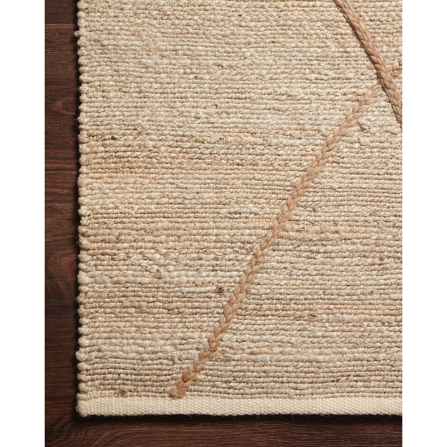 A tonal approach to Moroccan-inspired rugs, the Bodhi Ivory / Natural BOD-01 rug from Loloi is hand-woven of 100% jute. This rug features linear and braided details, creating natural variations that make a subtle yet striking statement for an entryway, living room, hallway or kitchen runner, or dining room. Amethyst Home provides interior design, new construction, custom furniture, and rugs for the Winter Park, Winter Garden, and Orlando, Florida metro area.