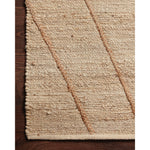 A tonal approach to Moroccan-inspired rugs, the Bodhi Ivory / Natural BOD-02 rug from Loloi is hand-woven of 100% jute. This rug features linear and braided details, creating natural variations that make a subtle yet striking statement for an entryway, living room, hallway or kitchen runner, or dining room. Amethyst Home provides interior design, new construction, custom furniture, and rugs for the Nashville metro area.
